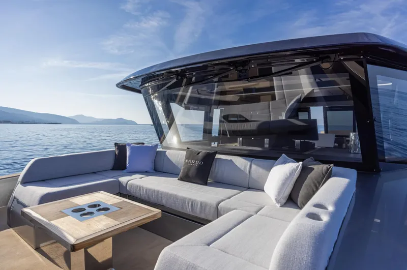  Yacht Photos Pics Luxurious 2026 Pardo Yachts GT75 with elegant outdoor seating and scenic ocean view.