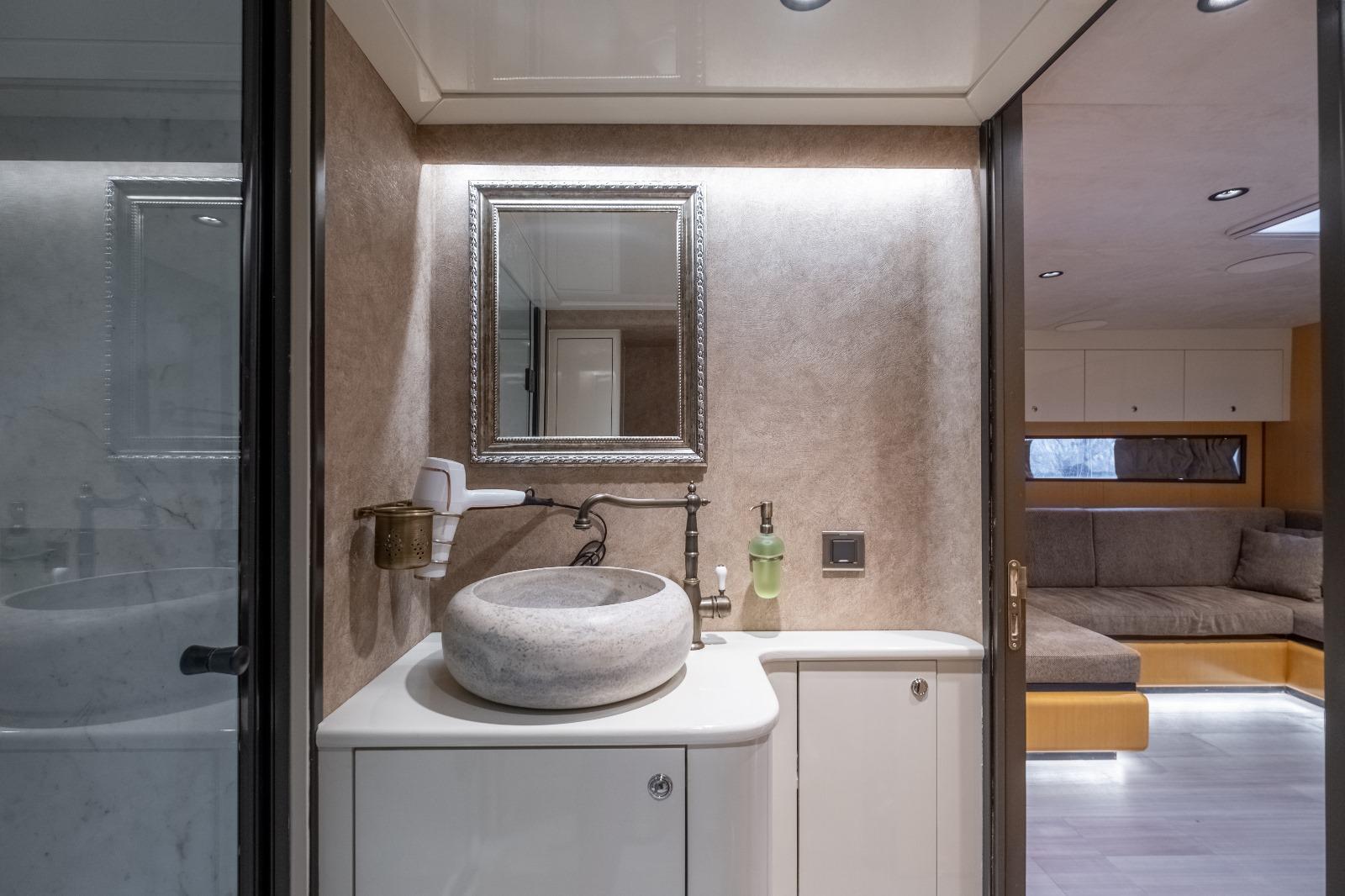 Luxurious bathroom in 2026 Phantom Spook Cabin Cruiser 62, featuring modern sink and elegant decor.