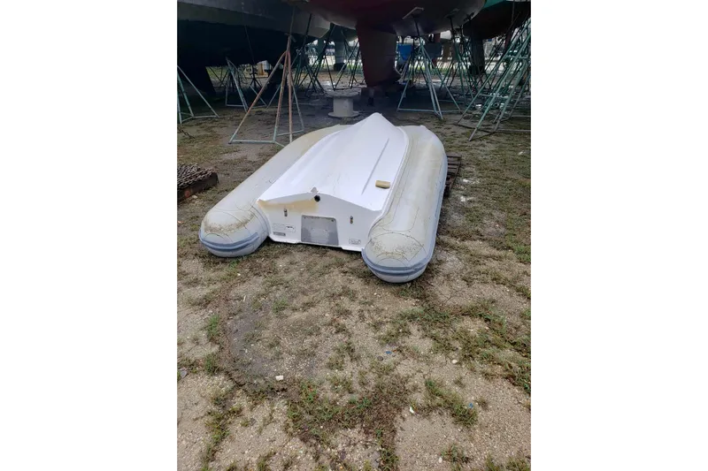Lady Vague Yacht Photos Pics Inflatable dinghy on ground near Beneteau 50 yacht, 2001 model, in boatyard.