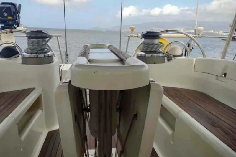 Lady Vague Yacht Photos Pics Cockpit view of 2001 Beneteau 50 sailboat with winches and ocean backdrop.