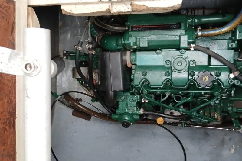  Yacht Photos Pics Engine compartment of a 2006 Fountaine Pajot Belize 43 catamaran, featuring a green marine engine.