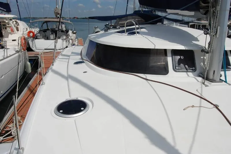  Yacht Photos Pics 2006 Fountaine Pajot Belize 43 catamaran docked at marina, showcasing sleek design.