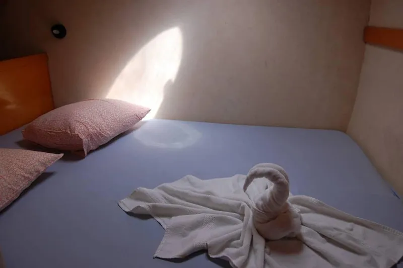  Yacht Photos Pics Cozy cabin bed in 2006 Fountaine Pajot Belize 43 catamaran with towel swan decoration.