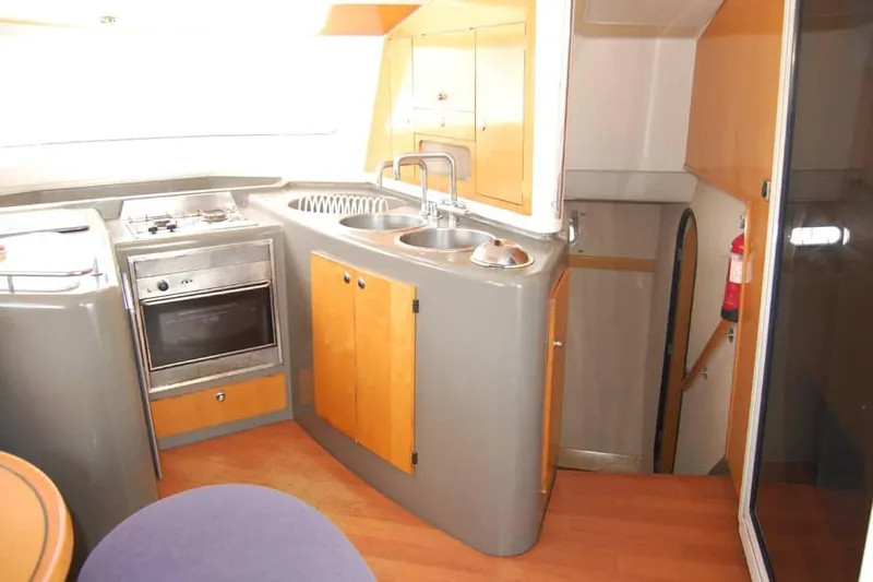  Yacht Photos Pics Interior of 2006 Fountaine Pajot Belize 43 catamaran kitchen with stove and sink.