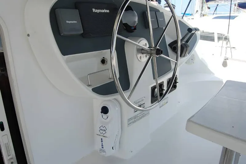  Yacht Photos Pics Steering wheel and controls of 2006 Fountaine Pajot Belize 43 catamaran.