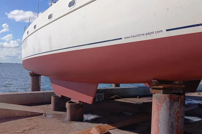 Yacht Photos Pics 2006 Fountaine Pajot Belize 43 catamaran on dry dock by the sea.
