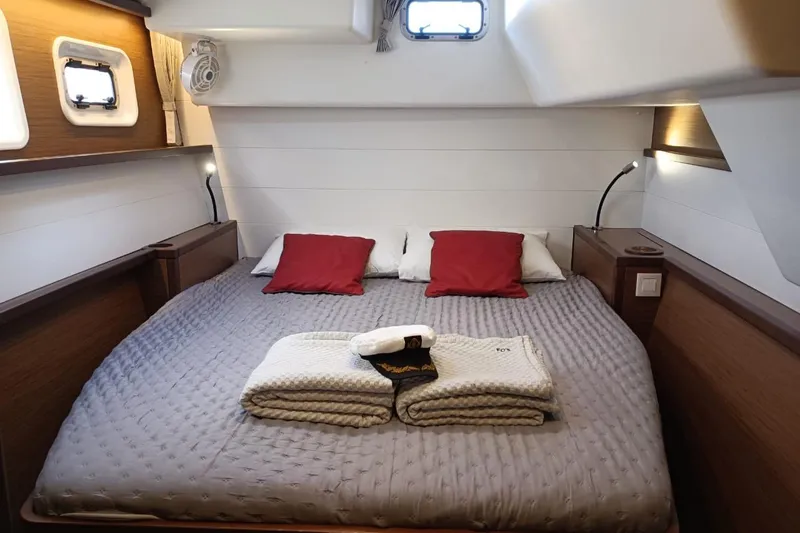  Yacht Photos Pics Luxurious cabin interior of 2020 Lagoon 450 F yacht with cozy bedding and modern design.