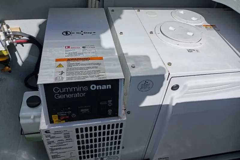  Yacht Photos Pics Cummins Onan generator on a 2020 Lagoon 450 F yacht, featuring safety warnings and controls.