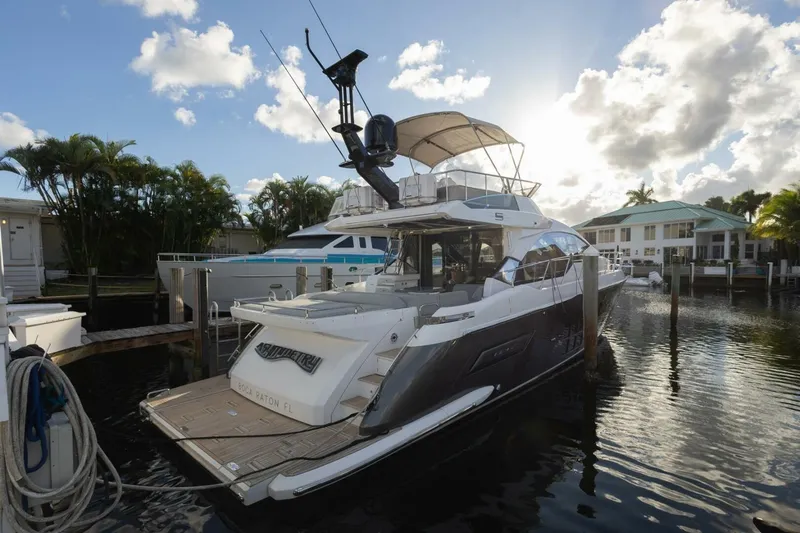 Asymmetry Yacht Photos Pics 2023 Azimut S6 Sport-Fly yacht docked in a sunny marina setting.