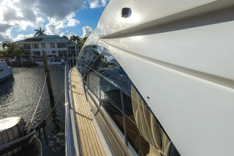 Asymmetry Yacht Photos Pics 2023 Azimut S6 Sport-Fly yacht docked, showcasing sleek design and luxurious features.