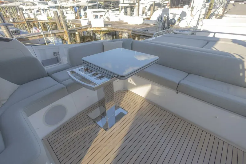 Asymmetry Yacht Photos Pics Luxurious seating area on 2023 Azimut S6 Sport-Fly yacht with sleek table and modern design.