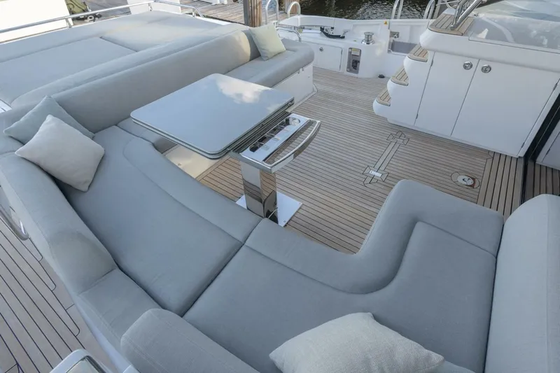 Asymmetry Yacht Photos Pics Luxurious seating area on 2023 Azimut S6 Sport-Fly yacht with elegant cushions and table.