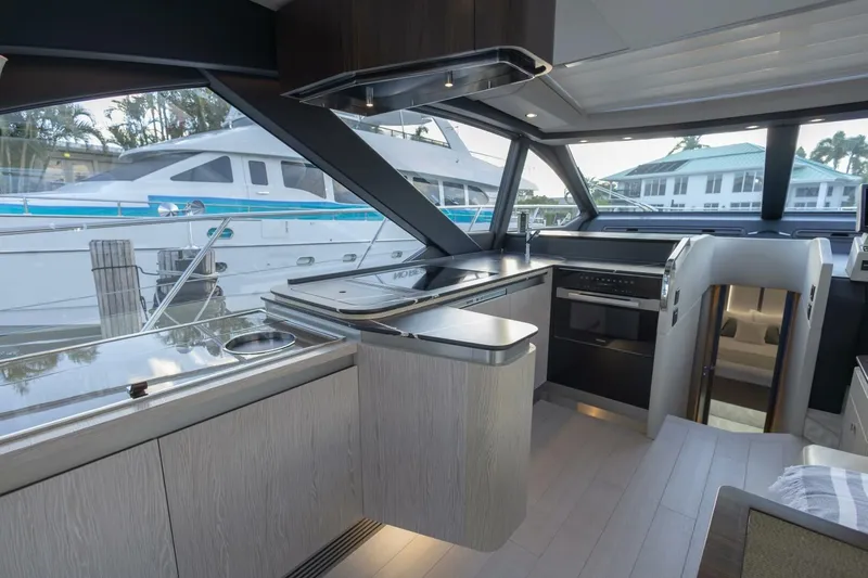 Asymmetry Yacht Photos Pics Modern interior of 2023 Azimut S6 Sport-Fly yacht with sleek kitchen design.