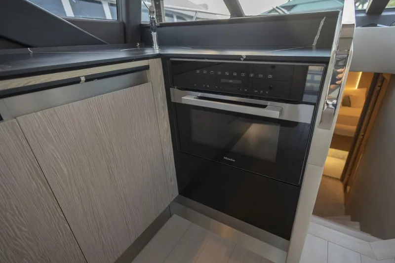 Asymmetry Yacht Photos Pics Modern kitchen interior of 2023 Azimut S6 Sport-Fly yacht with sleek appliances.