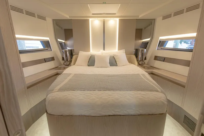 Asymmetry Yacht Photos Pics Luxurious bedroom interior of 2023 Azimut S6 Sport-Fly yacht with modern design and ambient lighting.