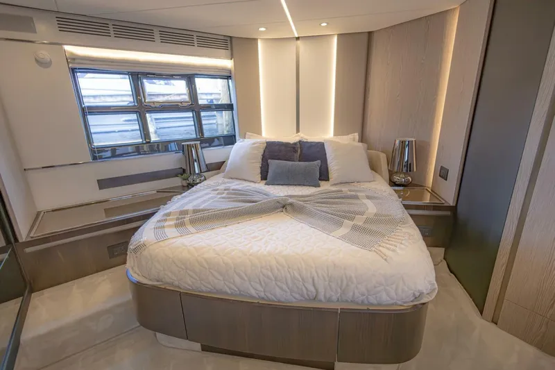 Asymmetry Yacht Photos Pics Luxurious bedroom interior of 2023 Azimut S6 Sport-Fly yacht with modern design and cozy bedding.