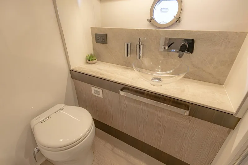 Asymmetry Yacht Photos Pics Luxurious bathroom in 2023 Azimut S6 Sport-Fly yacht with modern fixtures and elegant design.