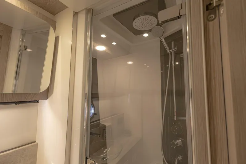 Asymmetry Yacht Photos Pics Luxurious bathroom interior of 2023 Azimut S6 Sport-Fly yacht with modern shower design.