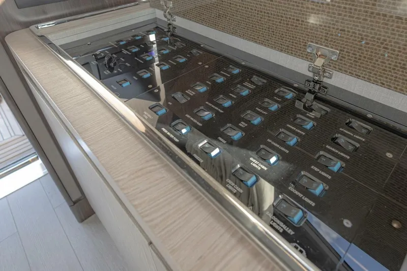 Asymmetry Yacht Photos Pics Control panel of 2023 Azimut S6 Sport-Fly yacht, featuring multiple switches and sleek design.