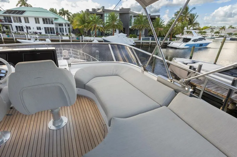 Asymmetry Yacht Photos Pics 2023 Azimut S6 Sport-Fly yacht with luxurious deck seating and marina view.