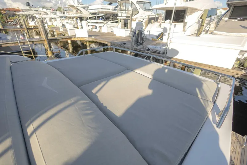 Asymmetry Yacht Photos Pics 2023 Azimut S6 Sport-Fly yacht with sunbathing area at marina.