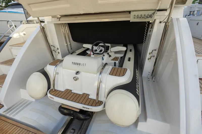 Asymmetry Yacht Photos Pics 2023 Azimut S6 Sport-Fly yacht with Turbojet tender in storage compartment.