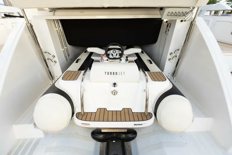 Asymmetry Yacht Photos Pics 2023 Azimut S6 Sport-Fly yacht with Turbojet tender in storage compartment.