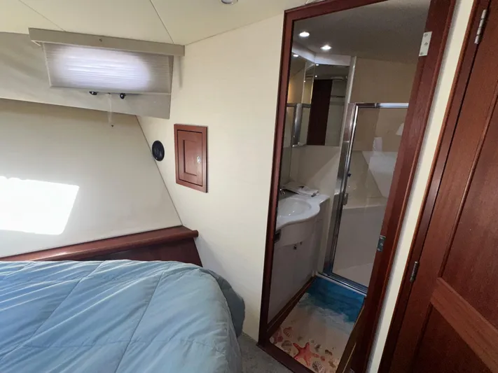 Odds Are Yacht Photos Pics Bedroom and bathroom interior of 2003 Pacific Mariner 65 SE Motoryacht.