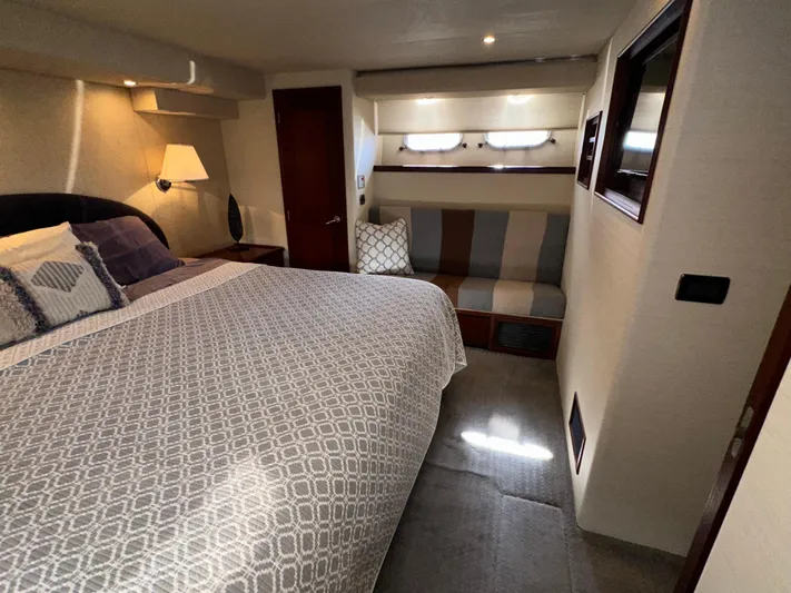 Odds Are Yacht Photos Pics Luxurious bedroom in 2003 Pacific Mariner 65 SE Motoryacht with cozy bed and seating area.