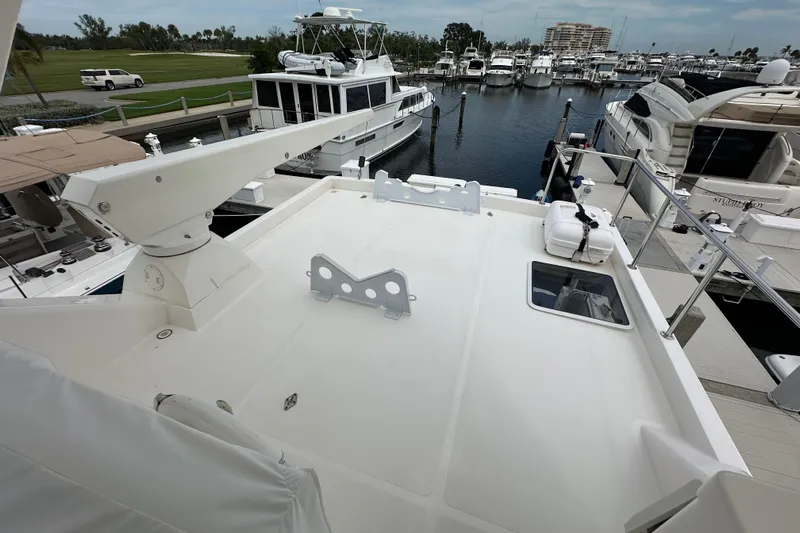 Odds Are Yacht Photos Pics 2003 Pacific Mariner 65 SE Motoryacht deck view at marina, surrounded by other boats.