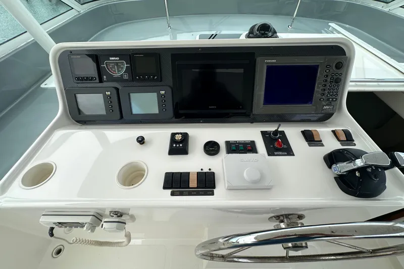 Odds Are Yacht Photos Pics Control panel of a 2003 Pacific Mariner 65 SE Motoryacht with navigation and communication equipment.