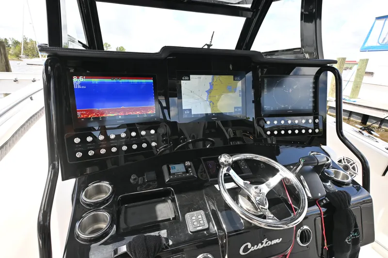 Yacht Photos Pics Control panel of 2023 Tidewater 380 CC Adventure boat with advanced navigation displays.