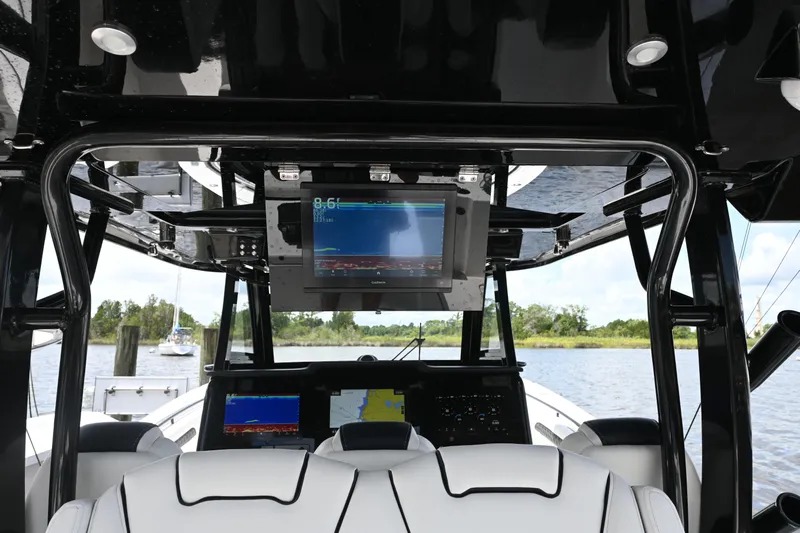  Yacht Photos Pics 2023 Tidewater 380 CC Adventure boat interior with advanced navigation screens.