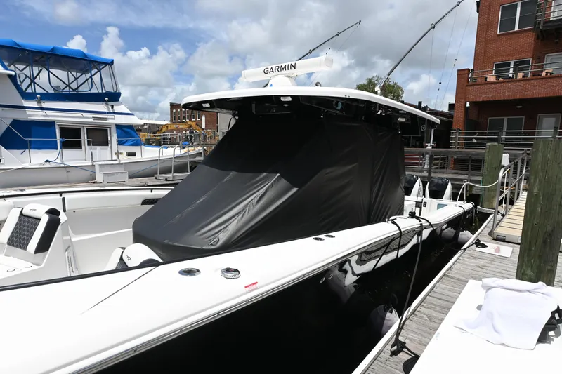  Yacht Photos Pics 2023 Tidewater 380 CC Adventure boat docked, featuring sleek design and modern equipment.