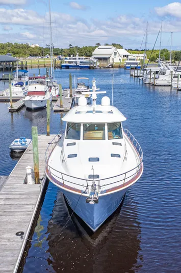 Sandcrab Yacht Photos Pics 2018 Sabre 66 Dirigo yacht docked in a marina, surrounded by other boats.