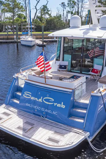 Sandcrab Yacht Photos Pics Sabre 66 Dirigo yacht, 2018 model, docked with American flags, named "Sand Crab."