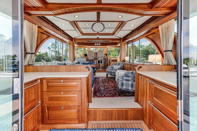 Sandcrab Yacht Photos Pics Luxurious interior of 2018 Sabre 66 Dirigo yacht with elegant wood finish and spacious seating.