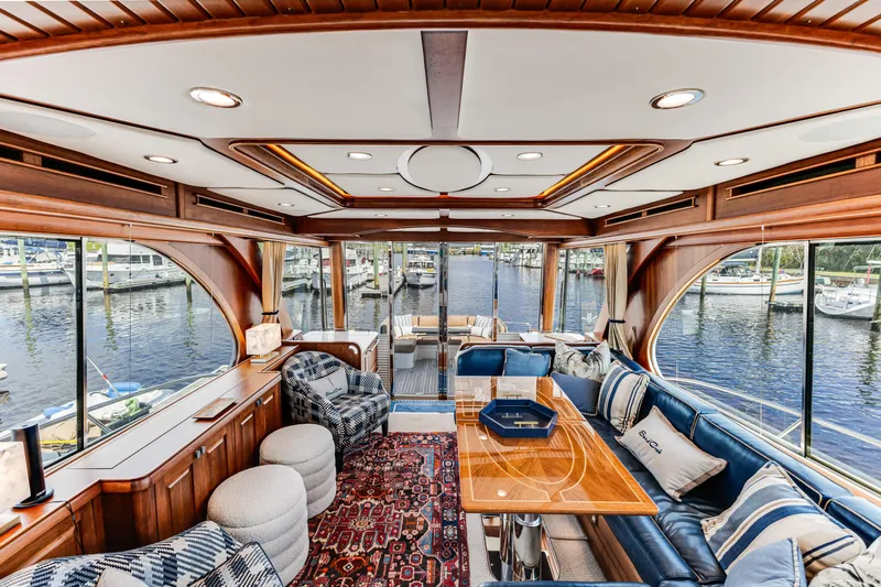 Sandcrab Yacht Photos Pics Luxurious interior of 2018 Sabre 66 Dirigo yacht with elegant seating and waterfront view.