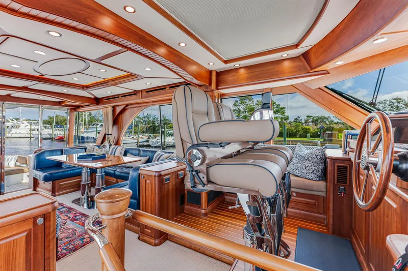Sandcrab Yacht Photos Pics Luxurious interior of 2018 Sabre 66 Dirigo yacht with elegant wood finishes and plush seating.