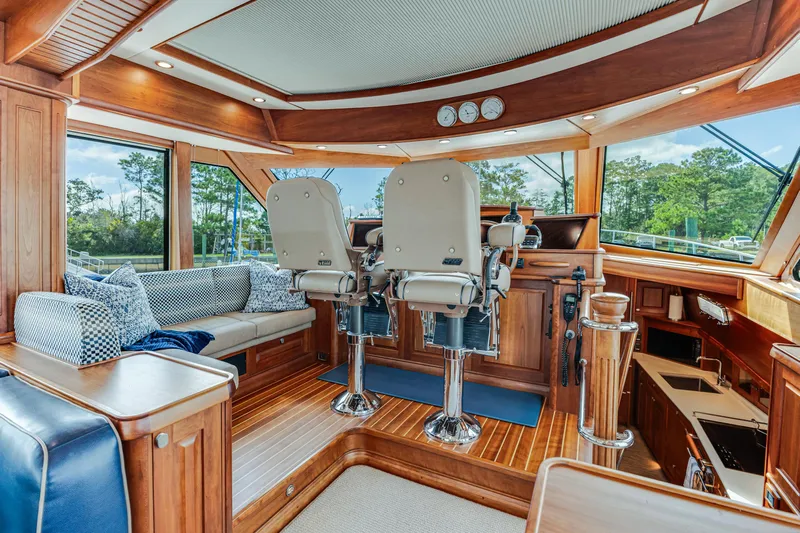 Sandcrab Yacht Photos Pics Luxurious interior of 2018 Sabre 66 Dirigo yacht with plush seating and wooden finishes.