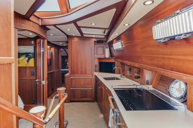 Sandcrab Yacht Photos Pics Luxurious interior of 2018 Sabre 66 Dirigo yacht with elegant wood finishes.