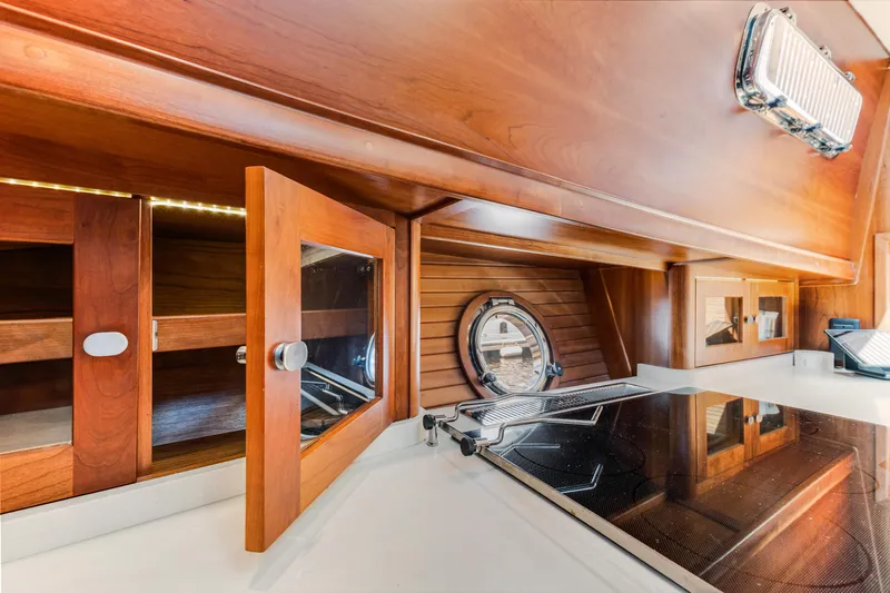 Sandcrab Yacht Photos Pics Interior of 2018 Sabre 66 Dirigo yacht with wooden cabinetry and modern kitchen appliances.