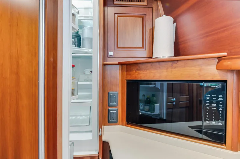 Sandcrab Yacht Photos Pics 2018 Sabre 66 Dirigo yacht kitchen with open fridge and microwave.