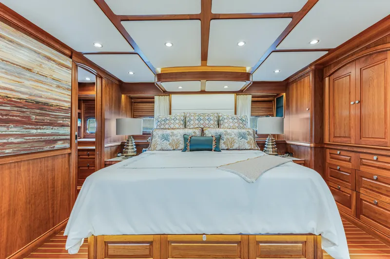 Sandcrab Yacht Photos Pics Luxurious 2018 Sabre 66 Dirigo yacht bedroom with elegant wood paneling and plush bedding.