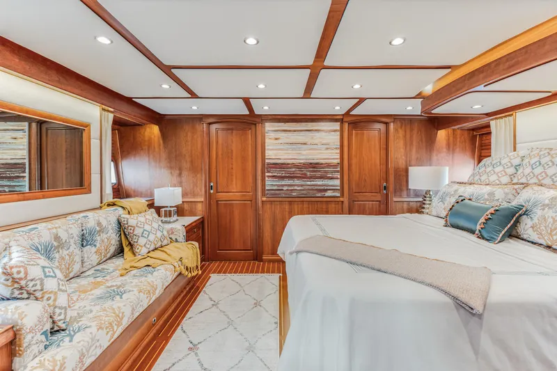 Sandcrab Yacht Photos Pics Luxurious interior of 2018 Sabre 66 Dirigo yacht with elegant wood paneling and plush bedding.