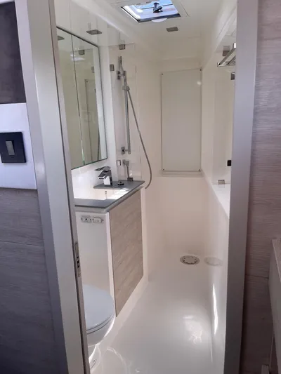 Seventeen Yacht Photos Pics Modern bathroom in 2020 Leopard 50 yacht with sleek fixtures and skylight.