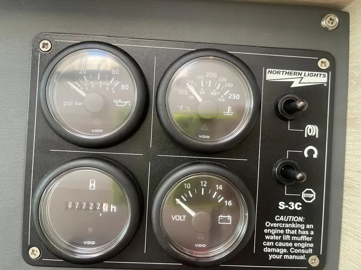 Seventeen Yacht Photos Pics Control panel of a 2020 Leopard 50 boat with gauges and warning labels.
