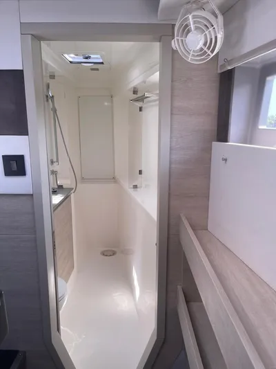 Seventeen Yacht Photos Pics Modern bathroom in a 2020 Leopard 50 yacht with sleek design and ample lighting.