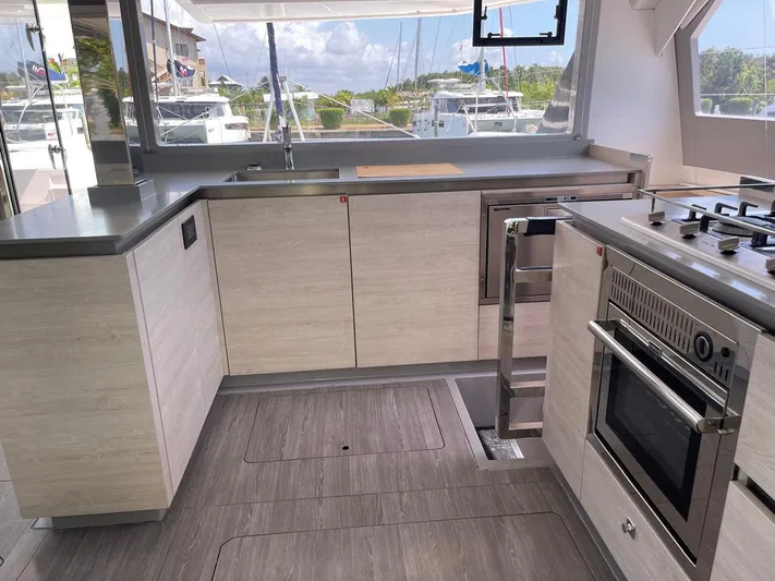 Seventeen Yacht Photos Pics Modern kitchen on a 2020 Leopard 50 yacht with sleek cabinetry and stainless steel appliances.