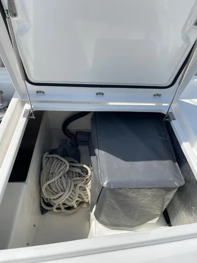 Seventeen Yacht Photos Pics Storage compartment of a 2020 Leopard 50 yacht with rope and covered equipment.